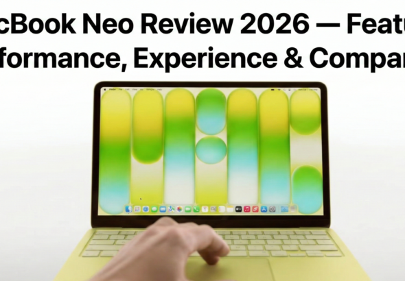 alt="MacBook Neo laptop on a modern desk, open and powered on, showing vibrant display and sleek aluminum design"